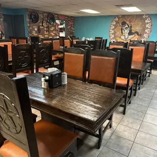 a dining room with tables and chairs