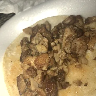 The piece of nail on her meat