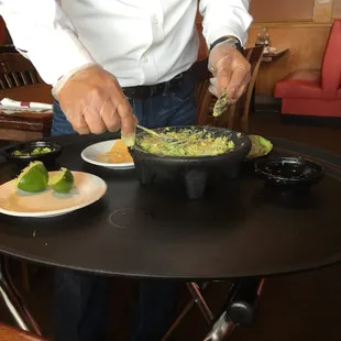 Yummy guacamole made fresh at the table!
