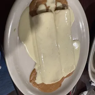 Two bean and cheese burritos