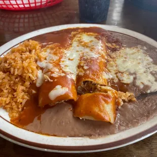 Enchiladas Rojas with Chicken Plate comes with rice and beans