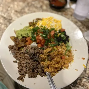 Burrito bowl, 3 sides; mexicali, grilled onions and guacamole