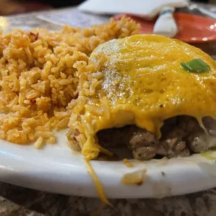 a plate of food with rice and meat