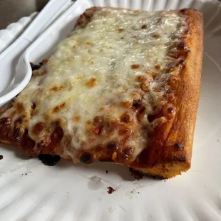 Old school sheet pan pizza on a paper plate. The Rebel way!