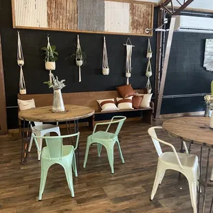 a dining area with tables and chairs