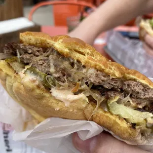 The OB burger complete with valley sauce on the thumb