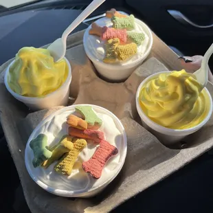 Two banana Soft Serve Ice Creams &amp; two pup cups with their mini bones.