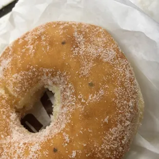 a doughnut covered in powdered sugar