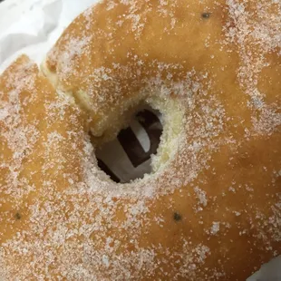 a half eaten doughnut with a bite taken out of it
