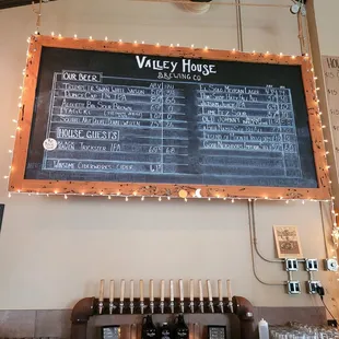 a chalkboard with a list of wines