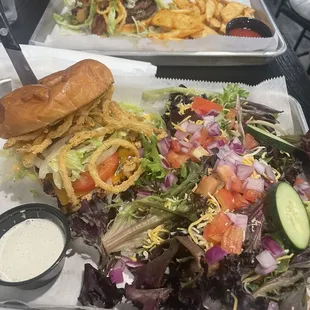 Blackened chicken sandwich and side salad