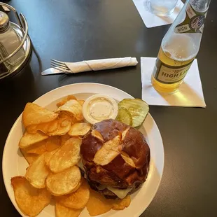 a burger and chips on a plate