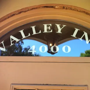 the reflection of the building in the window