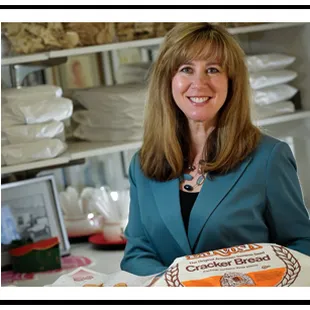 a woman holding a cake