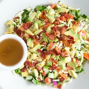 a plate of salad with dressing