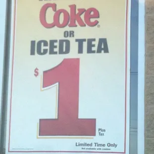 a sign advertising a coke or iced tea