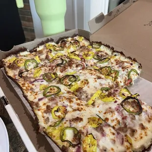 Build your own: jalapeño, banana peppers, red onion with red sauce.