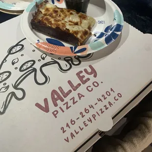 Two garlic cheese sticks/ dipping red sauce