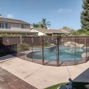 Recent 5 foot brown fence for a client, optimizing space for gathering outside the fenced area.