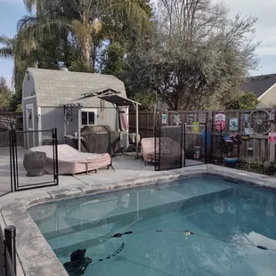 See how it's open and the fence is stored vertically? When you head inside, you just drop it into the original holes and go!