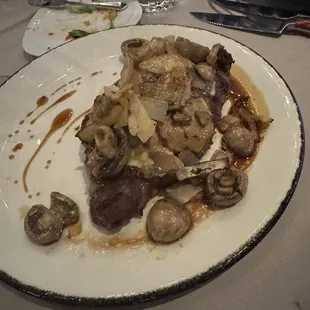 Delmonico steak with gorgonzola, onions and mishrooms