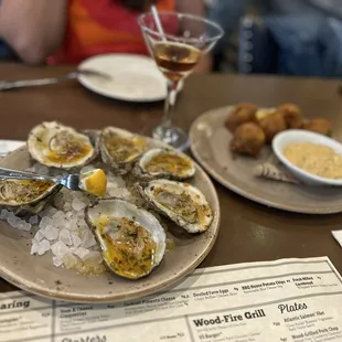 Wood grilled oysters and pork fritters