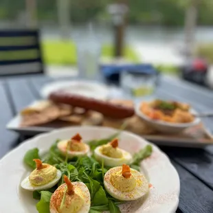 a plate of deviled eggs on a table