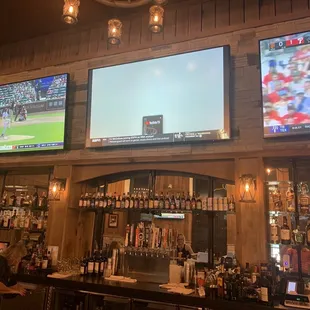 large screen televisions in a bar