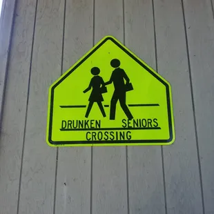 a yellow sign with the words drunken seniors crossing