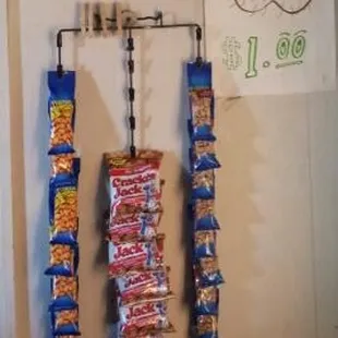 a display of snacks hanging on a wall