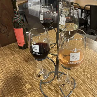 three glasses of wine on a table