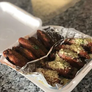 a tray of chicken wings on a counter
