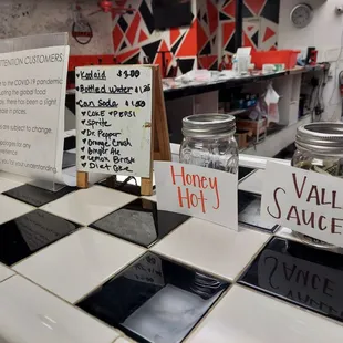a checkered counter with a variety of food items