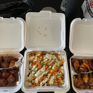 Boneless wings, Cajun (top) Korean BBQ (bottom) buffalo chicken frys and traditional wings, Honey hot (top) sweet chili (bottom)