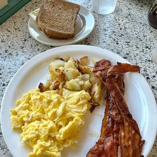 Two eggs, bacon, and side of home fries
