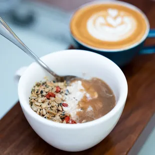 a bowl of oatmeal and a cup of coffee