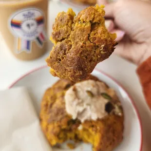 a hand holding a half eaten cookie