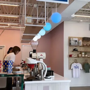 a woman working in a coffee shop