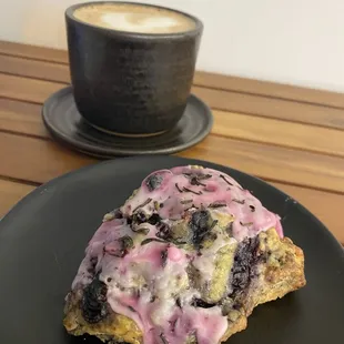 a blueberry scone and a cup of coffee