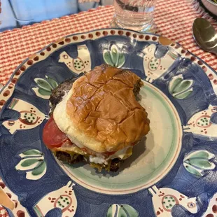 Mama burger with ketchup, mayo, tomato, pickles, and cheddar