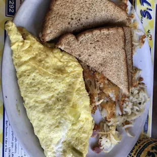 an omelet, toast, and a sandwich on a plate