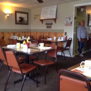 a dining room with tables and chairs