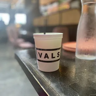 a cup of water on a table