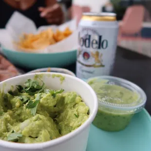 a bowl of guacamole and chips