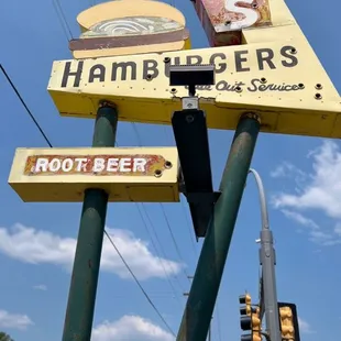 a hamburger and root beer sign