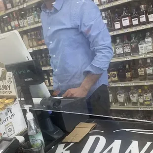 a man behind a cash register