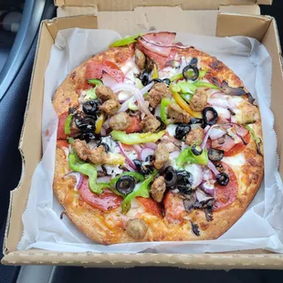 Deluxe Pizza (sausage, Canadian bacon, pepperoni, red onions, green peppers, black olives, mushrooms.