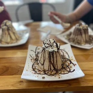 three desserts on plates
