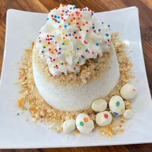 a cake with sprinkles and sprinkles