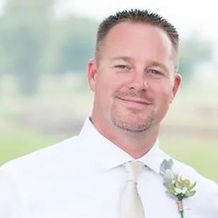 a man in a white shirt and tie